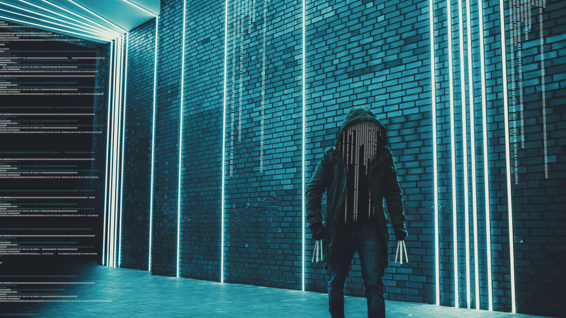 hooded cyber criminal in computer room