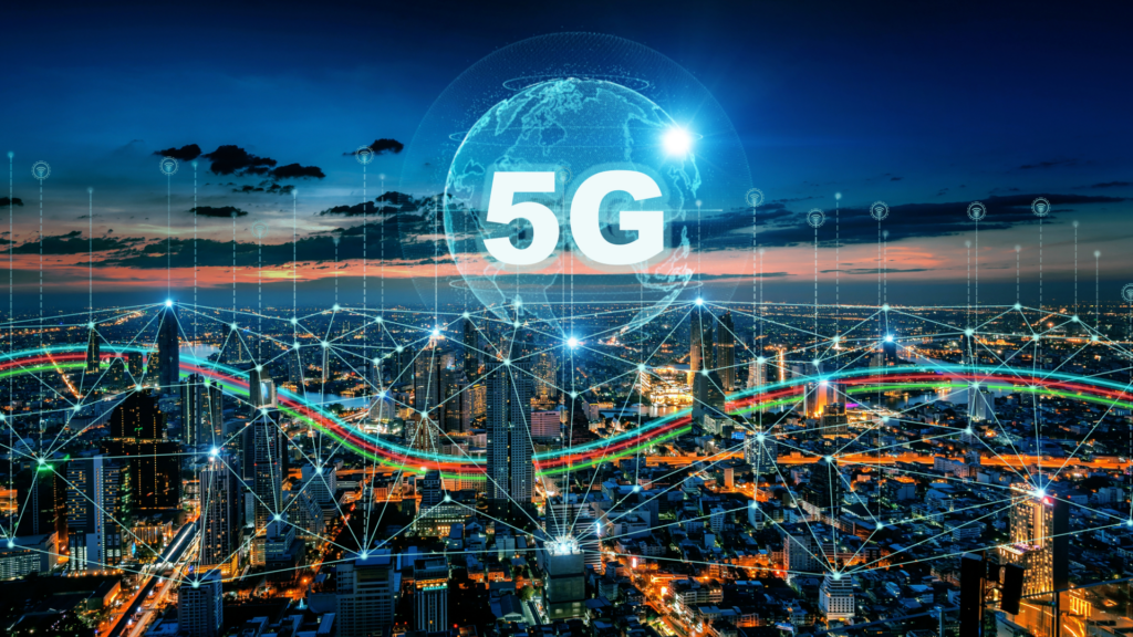 5g text hovering over city skyline with other tech imagery floating around